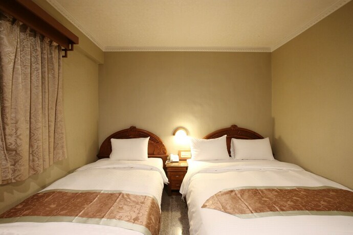 Imagen de la habitación del Hotel Mei Jia Mei. Foto 14