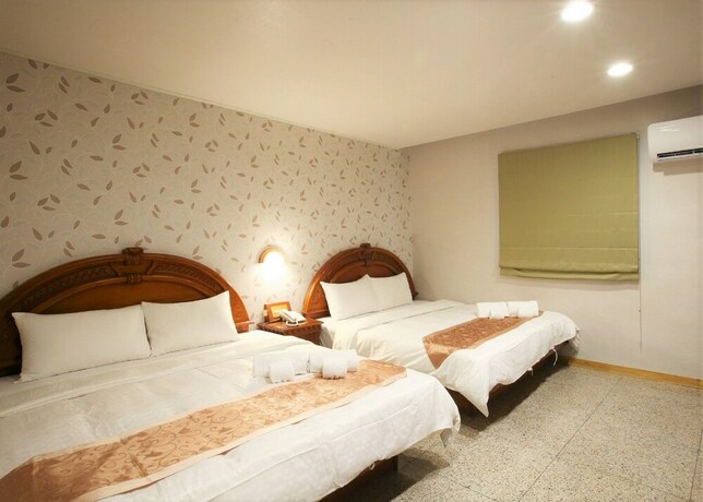 Imagen de la habitación del Hotel Mei Jia Mei. Foto 15