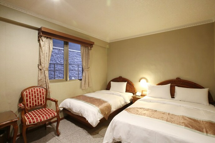 Imagen de la habitación del Hotel Mei Jia Mei. Foto 16