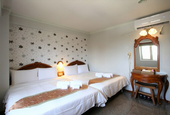 Imagen de la habitación del Hotel Mei Jia Mei. Foto 17