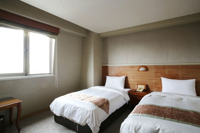 Imagen de la habitación del Hotel Mei Jia Mei. Foto 19