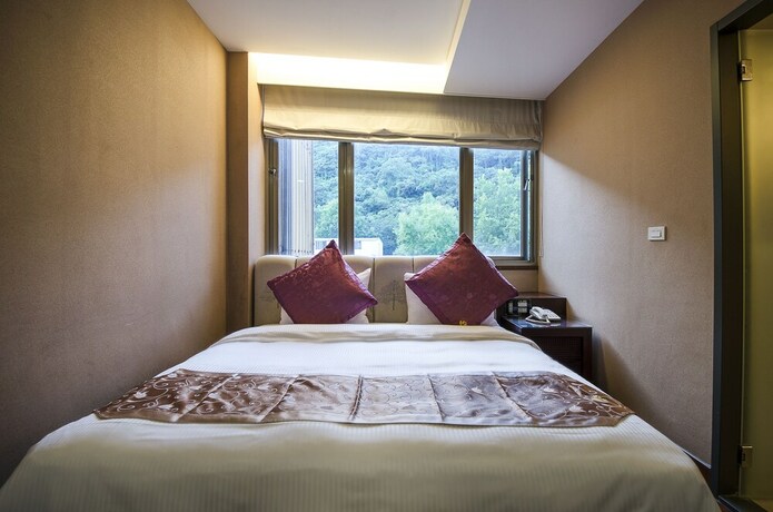 Imagen de la habitación del Hotel Mei Jia Mei. Foto 26
