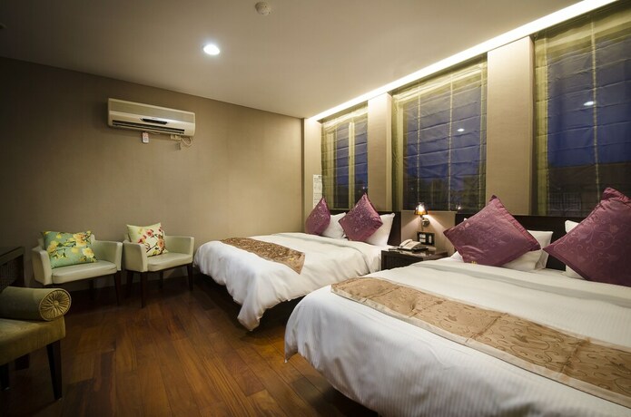 Imagen de la habitación del Hotel Mei Jia Mei. Foto 27