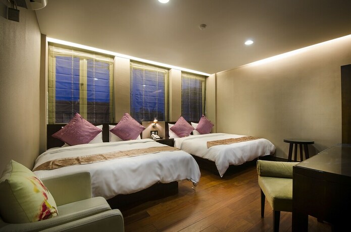Imagen de la habitación del Hotel Mei Jia Mei. Foto 30