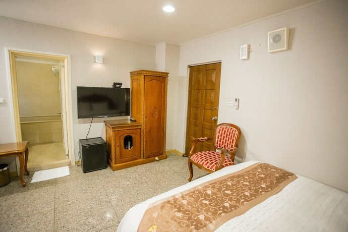 Imagen de la habitación del Hotel Mei Jia Mei. Foto 31