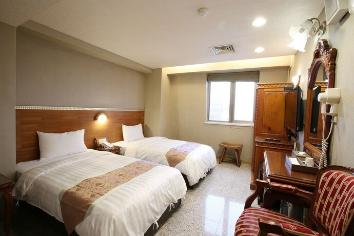 Imagen de la habitación del Hotel Mei Jia Mei. Foto 33