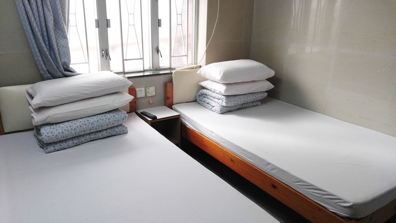 Imagen de la habitación del Hotel Mei Wah Guesthouse. Foto 7