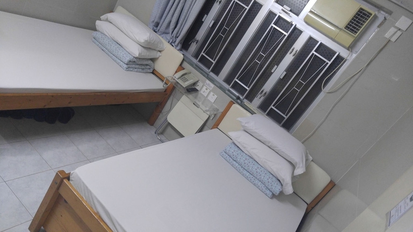 Imagen de la habitación del Hotel Mei Wah Guesthouse. Foto 8