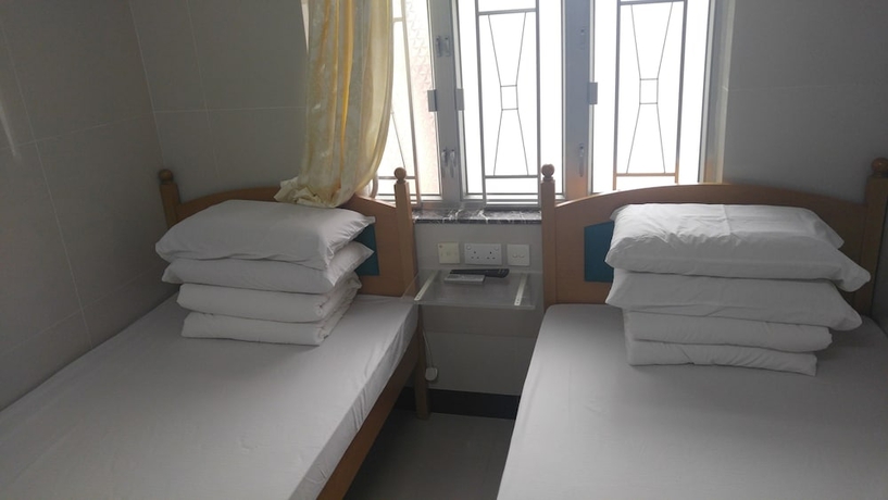 Imagen de la habitación del Hotel Mei Wah Guesthouse. Foto 11