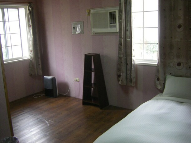 Imagen de la habitación del Hotel Meihua Lake Leisure Farm. Foto 12