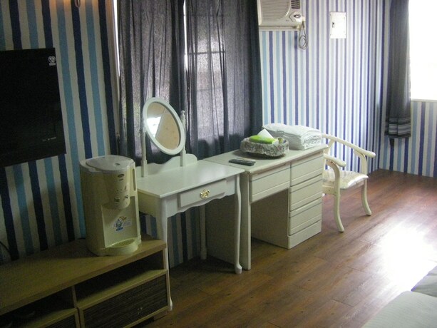 Imagen de la habitación del Hotel Meihua Lake Leisure Farm. Foto 13