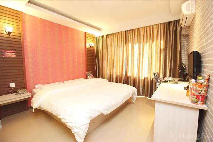 Imagen de la habitación del Hotel Meijia Fashion Hotel. Foto 7