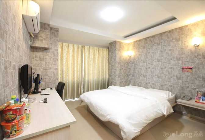 Imagen de la habitación del Hotel Meijia Fashion Hotel. Foto 8