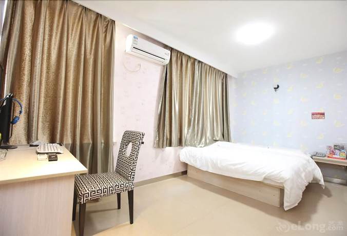 Imagen de la habitación del Hotel Meijia Fashion Hotel. Foto 9