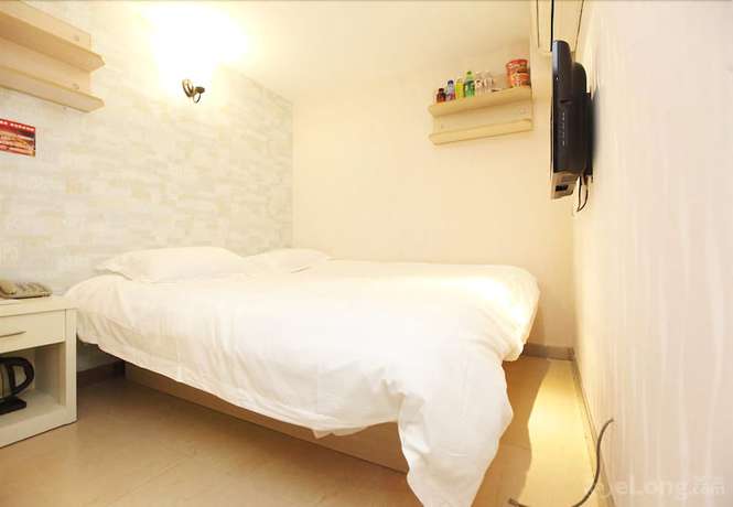 Imagen de la habitación del Hotel Meijia Fashion Hotel. Foto 12