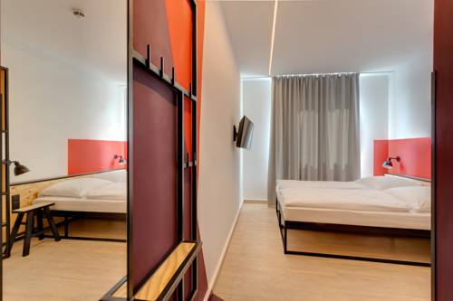 Imagen de la habitación del Hotel Meininger Leipzig Hauptbahnhof. Foto 10