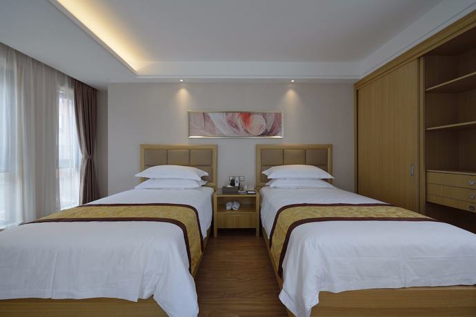 Imagen de la habitación del Hotel Meiqianju Garden. Foto 14
