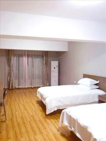 Imagen de la habitación del Hotel Meisiqi Hotel. Foto 2