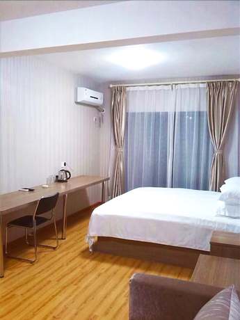 Imagen de la habitación del Hotel Meisiqi Hotel. Foto 3