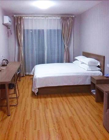 Imagen de la habitación del Hotel Meisiqi Hotel. Foto 4