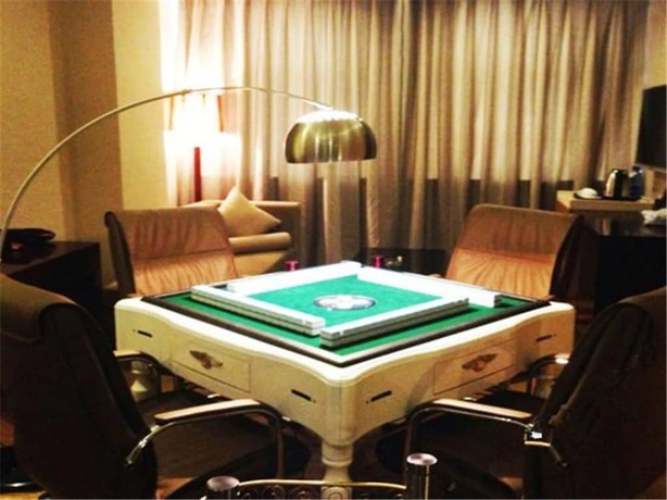 Imagen de la habitación del Hotel Meisiqi Hotel. Foto 6