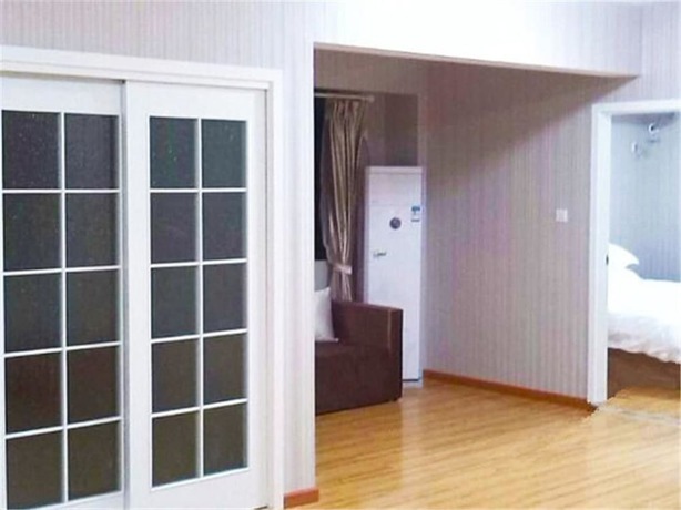 Imagen de la habitación del Hotel Meisiqi Hotel. Foto 7