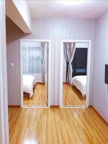 Imagen de la habitación del Hotel Meisiqi Hotel. Foto 8