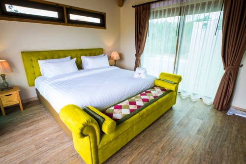 Imagen de la habitación del Hotel Mela Garden Retreat Cottage. Foto 8