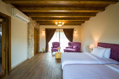 Imagen de la habitación del Hotel Mela Garden Retreat Cottage. Foto 11