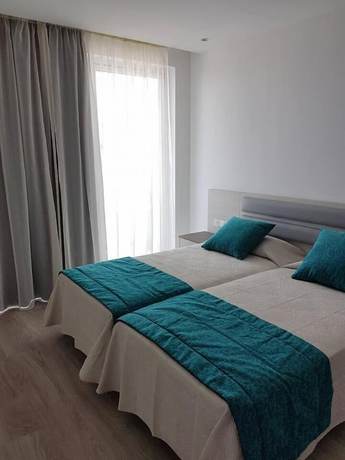Imagen de la habitación del Hotel Melini Suites. Foto 13