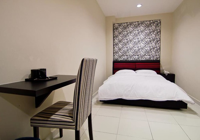 Imagen de la habitación del Hotel Melody Inn. Foto 11