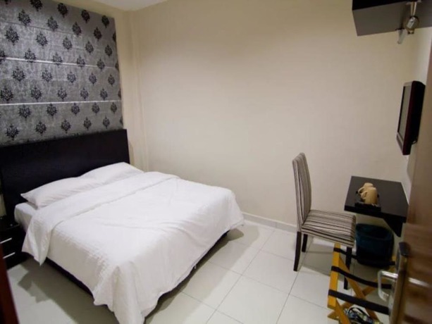 Imagen de la habitación del Hotel Melody Inn. Foto 14