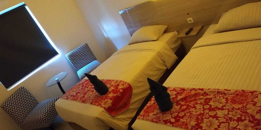 Imagen de la habitación del Hotel Mel\'s Inn Manado. Foto 13