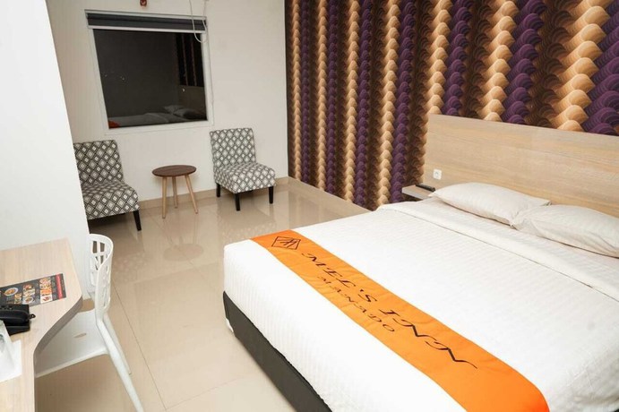 Imagen de la habitación del Hotel Mel\'s Inn Manado. Foto 14
