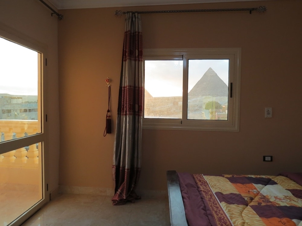 Imagen de la habitación del Hotel Mena Inn Pyramids. Foto 8
