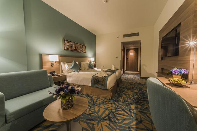 Imagen de la habitación del Hotel Mena Plaza Albarsha. Foto 5