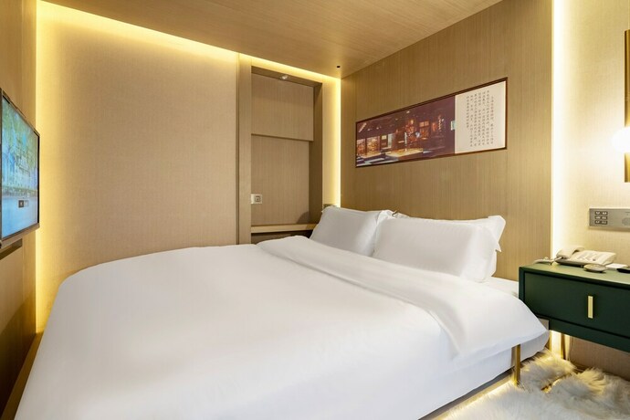 Imagen de la habitación del Hotel Mengguo Wisdom. Foto 8