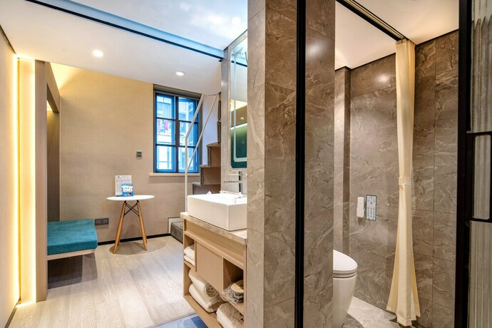 Imagen de la habitación del Hotel Mengguo Wisdom. Foto 10