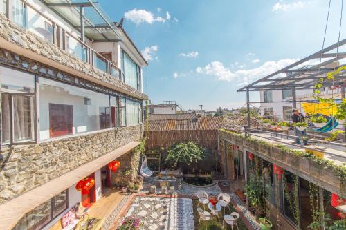 Imagen de la habitación del Hotel Mengyuanju Boutique Inn. Foto 9