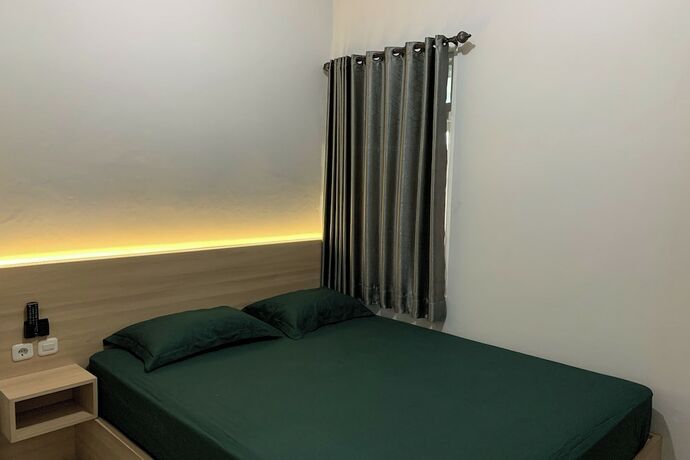 Imagen de la habitación del Hotel Merak Indah. Foto 18