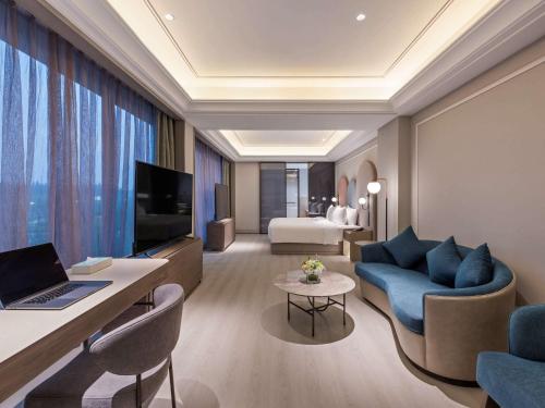 Imagen de la habitación del Hotel Mercure Dongtai Huanghai Forest. Foto 17