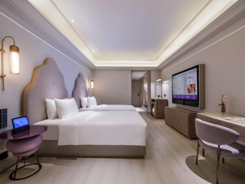 Imagen de la habitación del Hotel Mercure Dongtai Huanghai Forest. Foto 18