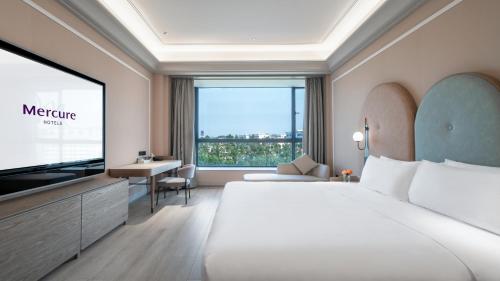 Imagen de la habitación del Hotel Mercure Guangzhou Baiyun International Airport. Foto 18