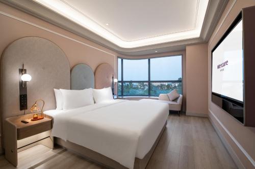 Imagen de la habitación del Hotel Mercure Guangzhou Baiyun International Airport. Foto 19