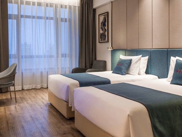Imagen de la habitación del Hotel Mercure Harbin Songbei. Foto 13