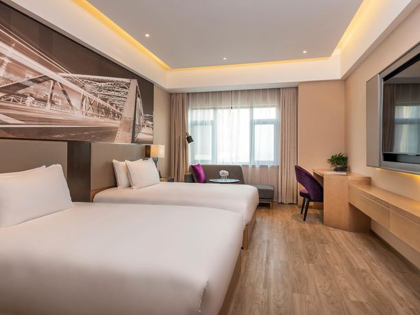 Imagen de la habitación del Hotel Mercure Shanghai Jiuting. Foto 10