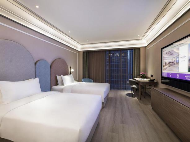 Imagen de la habitación del Hotel Mercure Shanghai Qiantan. Foto 7