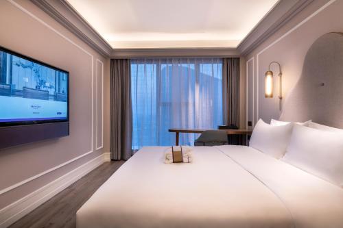 Imagen de la habitación del Hotel Mercure Suzhou Jinji Lake. Foto 9