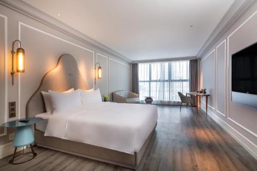 Imagen de la habitación del Hotel Mercure Suzhou Jinji Lake. Foto 10