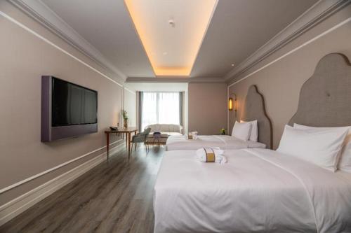 Imagen de la habitación del Hotel Mercure Suzhou Jinji Lake. Foto 14